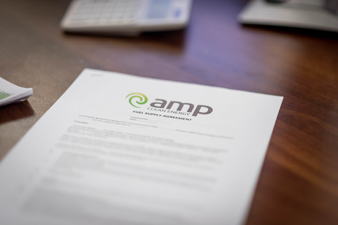 AMP Clean Energy Fuel Supply Agreement document on desk